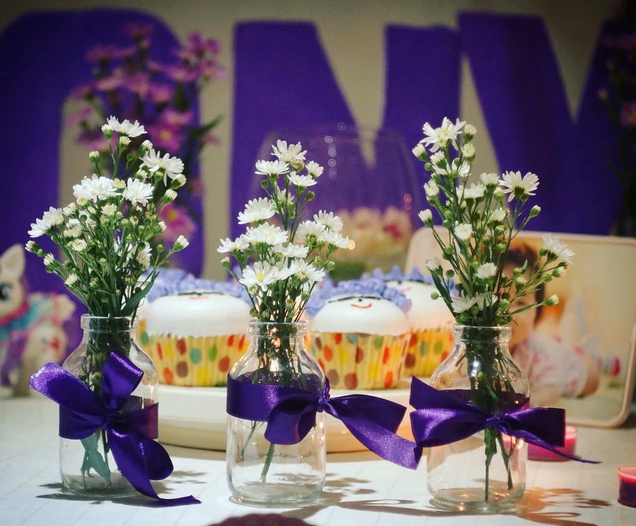 indoors, table, vase, flower, decoration, home interior, potted plant, freshness, still life, chair, flower arrangement, focus on foreground, glass - material, bouquet, flower pot, fragility, dining table, celebration, close-up, bunch of flowers