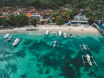 High angle view of boats and beach by the sea