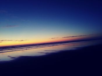 Scenic view of sea against clear sky during sunset
