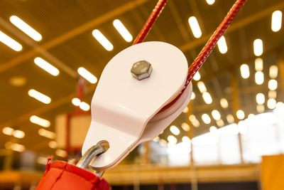 Low angle view of illuminated lighting equipment hanging on ceiling