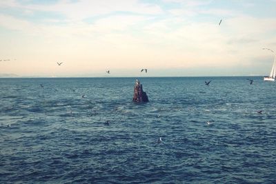 Scenic view of sea against cloudy sky