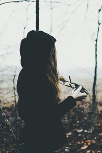 Woman with camera outdoors