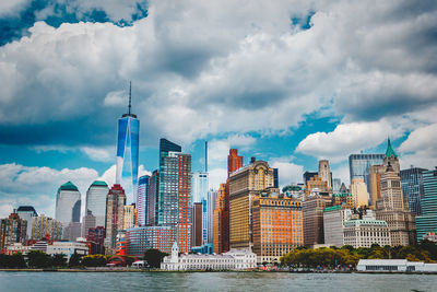 Cityscape against cloudy sky