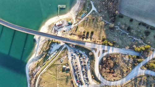 Drone view of cars by bridge over river