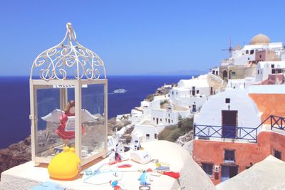 Panoramic view of sea and buildings against sky