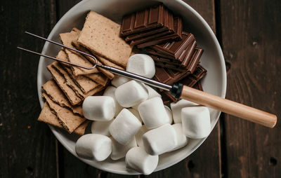 Skewer for s'mores, graham crackers, chocolate, marshmallows