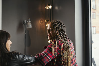 Coworkers talking during coffee break