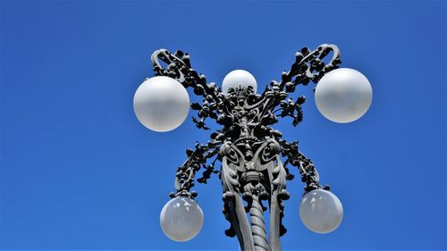 Low angle view of street light against sky