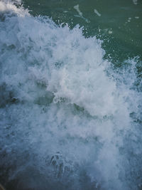 High angle view of water flowing in sea