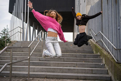 High angle view of woman walking on staircase
