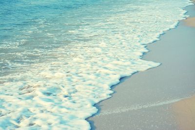 Close-up of surf on beach