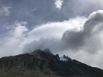 Low angle view of mountain range against sky