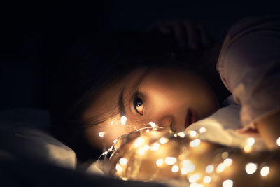 Close-up portrait of cute girl at home