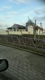 Built structure against cloudy sky