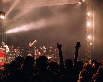 People enjoying music concert