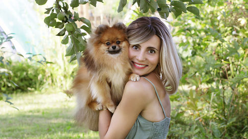 Portrait of woman with dog