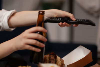 Cropped hand of man holding food