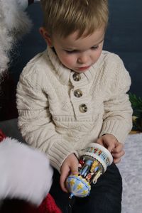 Boy holding toy during christmas