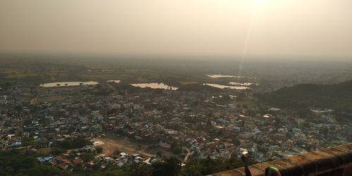 High angle view of townscape against sky in city