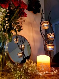 Close-up of illuminated lamp on table