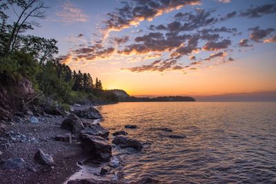 Scenic view of sea against sky during sunset