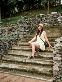 Young woman sitting on steps