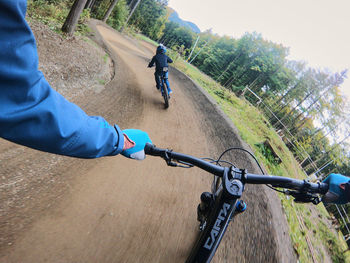 Man riding bicycle on road