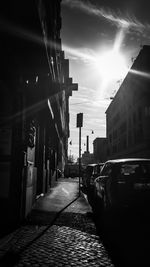 Street amidst buildings in city against sky