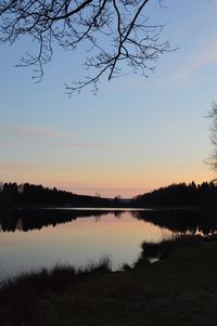 Scenic view of lake against sky during sunset