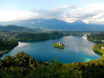 Scenic view of lake and mountains against sky