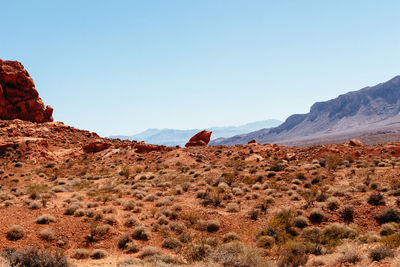 Scenic view of rocky mountains against clear blue sky