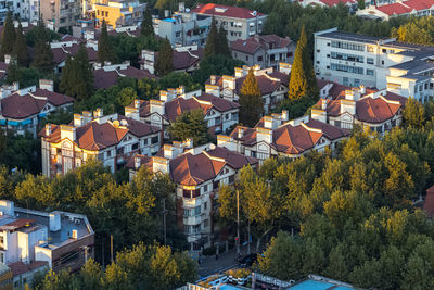 High angle view of illuminated buildings in city