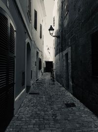 Narrow alley amidst buildings in city