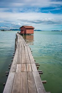 Pier over sea against sky