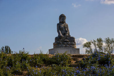 Low angle view of statue against sky