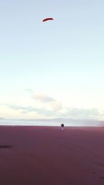 Hot air balloon flying over sea