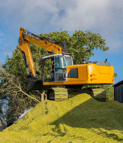 Agricultural machinery tractor and chopper during the corn harvest