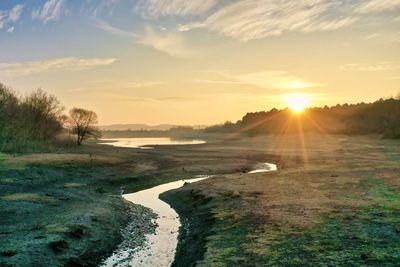 Scenic view of landscape against sky during sunset