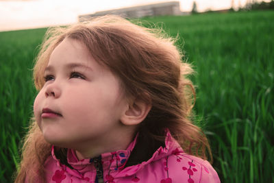 Close-up of girl on field