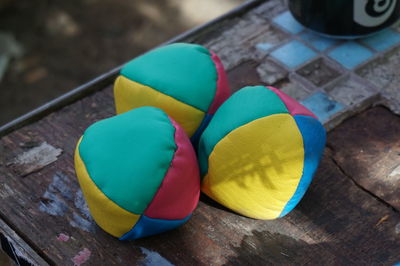 High angle view of colorful juggling balls on table