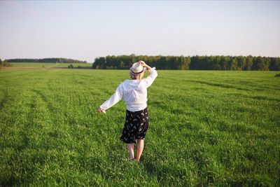 Full length of man on field