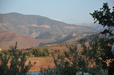 Scenic view of landscape and mountains against sky