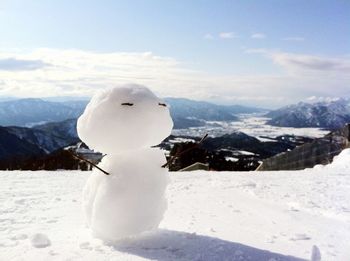 Scenic view of snow covered mountains