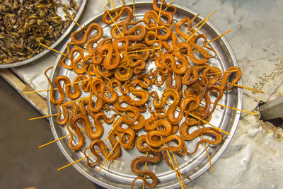 Grilled snakes on sale for food market in china