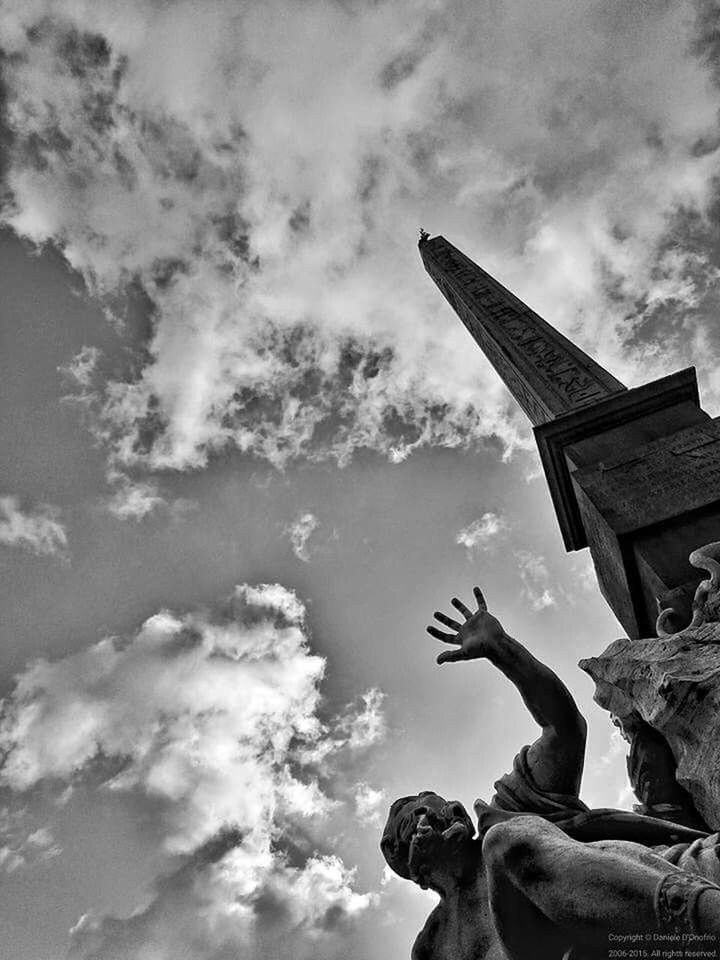 LOW ANGLE VIEW OF STATUE AGAINST CLOUDY SKY