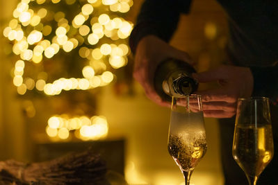 Man holding wine bottle celebrating xmas.