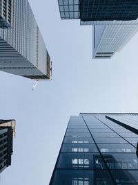 Low angle view of modern buildings against clear sky, new york