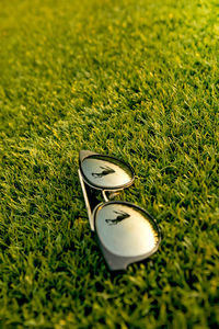 High angle view of sunglasses on grass