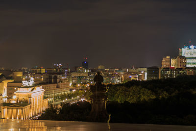 Illuminated buildings in city at night