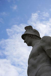 Low angle view of statue against cloudy sky